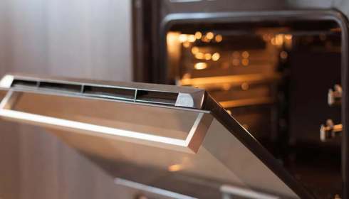 Why does my oven stink when I turn it on